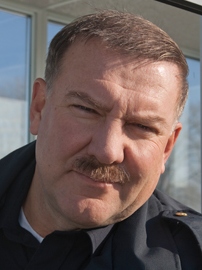Alex Lifeson as a border guard in <i>Suck</i> - photo courtesy suckthemovie.com