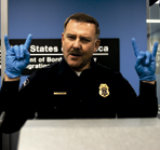 Alex Lifeson as a border officer in Suck